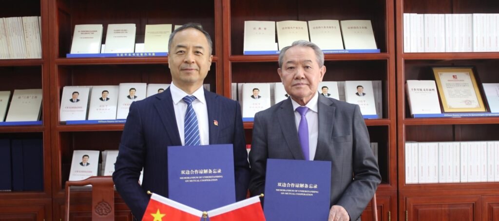The Vice-Rector of the Kyrgyz National University poses for a photo with the Deputy Editor-in-Chief, People's Daily, after the signing of a memorandum of cooperation between Kyrgyz National University and People's Daily, on May 2026. SOURCE: Kyrgyz National University
